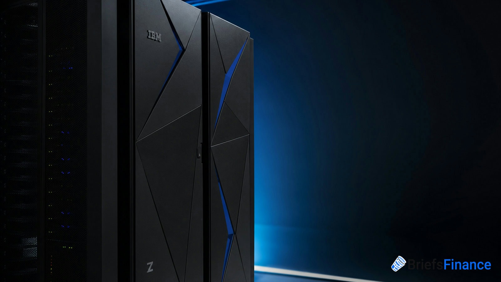 A close-up of several sleek black server racks with blue lighting, featuring the IBM logo, in a dimly lit data center.