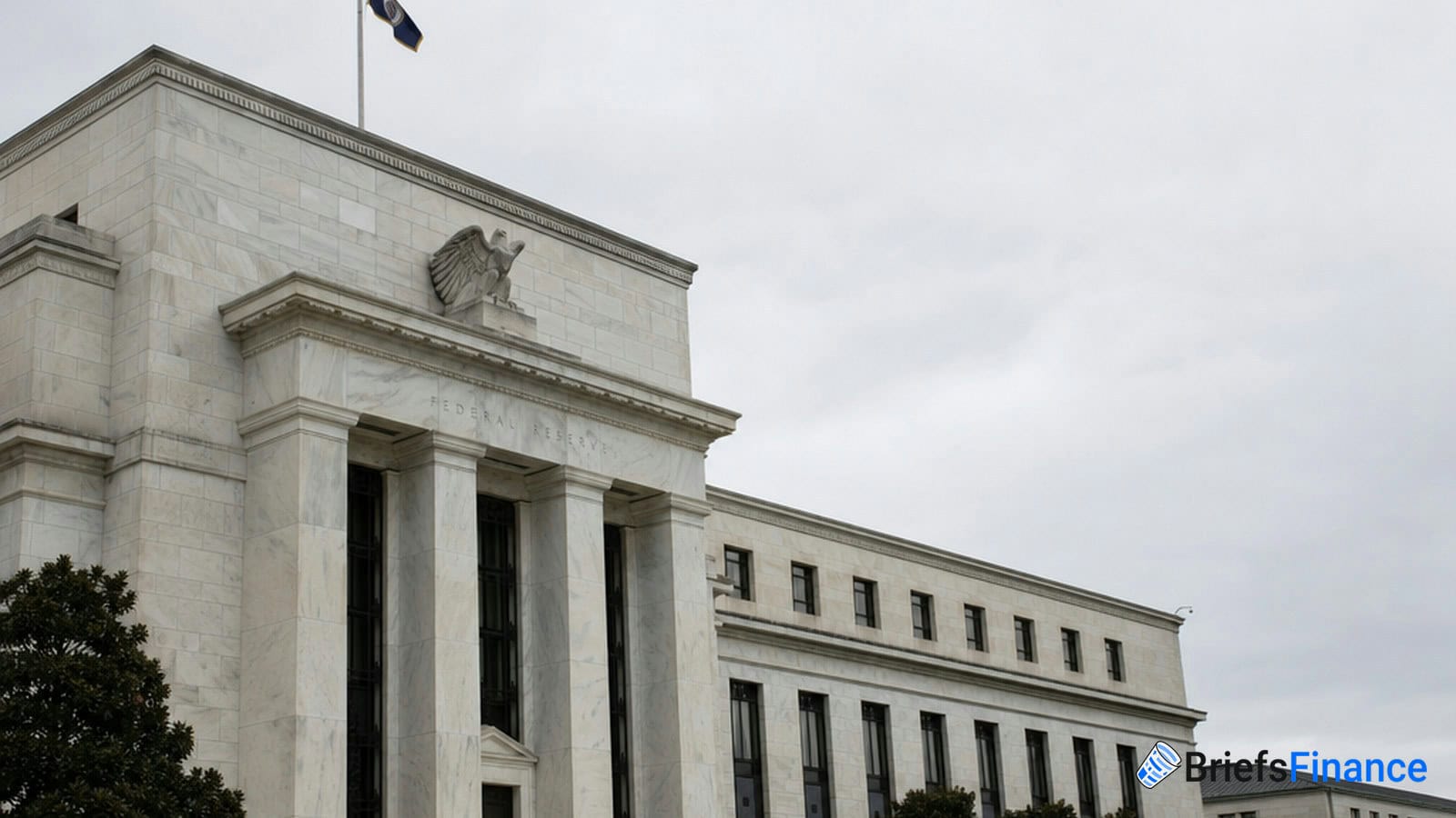 The exterior of a large, white stone government building with columns, an eagle emblem, and a flag on the roof.