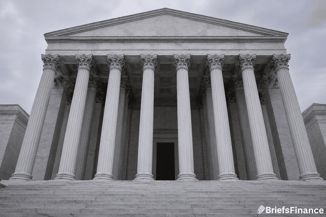 The front view of a neoclassical building with tall columns and steps leading to a large entrance, under a cloudy sky. A BriefsFinance logo is visible in the bottom right corner.